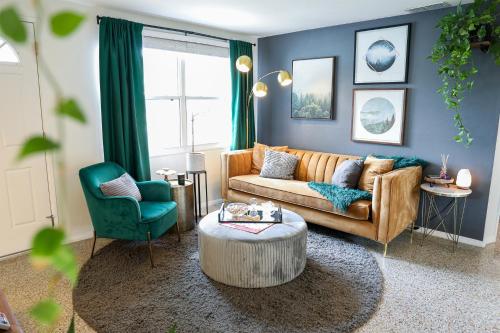 a living room with a couch and a table at Mystic Haven - Hot Tub, BBQ Grill, Beaches, Pet Friendly in Largo