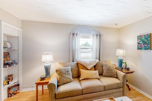 a living room with a couch and a window at Maplewood Manor - Unit 2 in Colchester