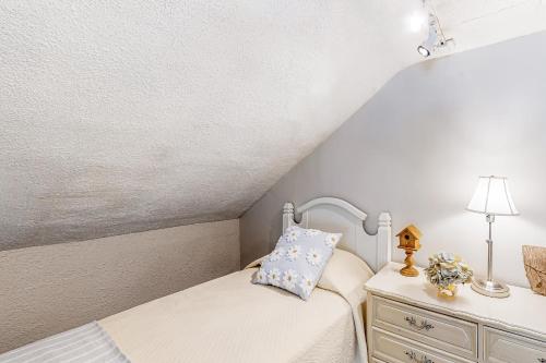 a small bedroom with a bed and a dresser at Maplewood Manor - Unit 2 in Colchester