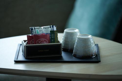a tray with two candles on a table at Hotel Sunroute Ginza in Tokyo