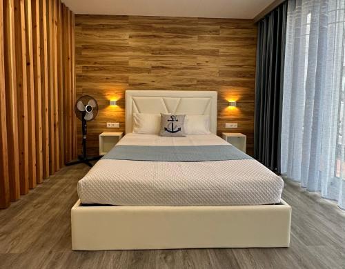Ένα ή περισσότερα κρεβάτια σε δωμάτιο στο Paradise Apartments II