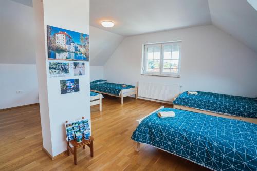 Postel nebo postele na pokoji v ubytování Apartment Sneznik