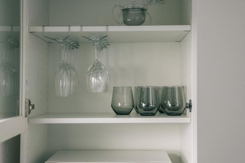 a shelf with four wine glasses on it at ambit - Vacation STAY 99416v in Kami Amakusa