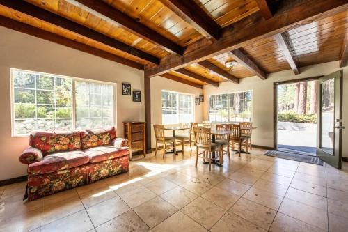 a living room with a couch and a table at Emerald Bay Lodge in South Lake Tahoe