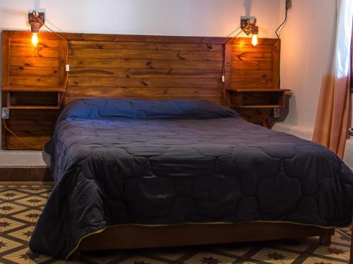 En eller flere senge i et værelse på finca el Rincón