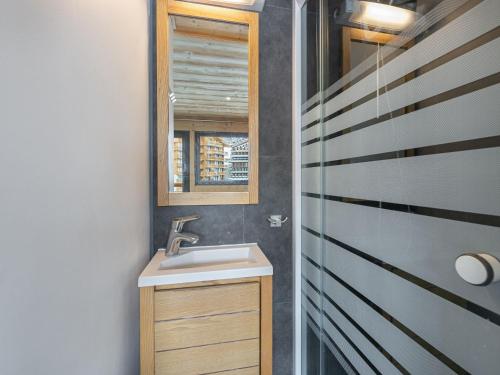a bathroom with a sink and a mirror at Spacieux appart. 12 pers. au cœur de Val Thorens avec balcon et WiFi - FR-1-640-3 in Val Thorens
