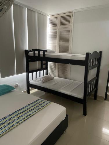 Postel nebo postele na pokoji v ubytování Alojamientos Cartagena Edificio Los Delfines