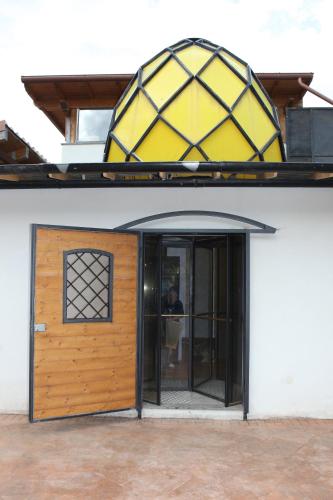 a building with a wooden door and a window at Villa Monti Lepini in Segni