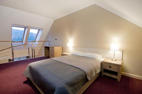 Postel nebo postele na pokoji v ubytování Tęczowe Wzgórze