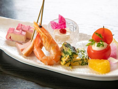 a plate of food with shrimp and other foods at Tsuruya / Vacation STAY 59061 in Miyaji