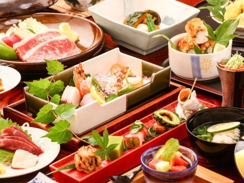 a table with many different types of food on it at Tsuruya / Vacation STAY 59052 in Miyaji