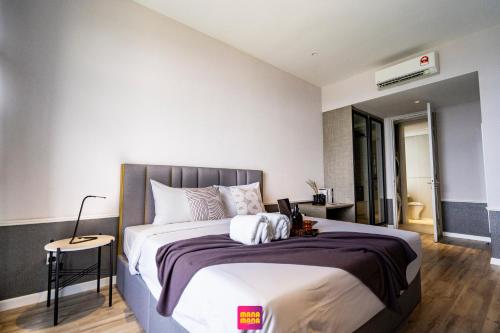 a bedroom with a large bed in a room at Millerz Square Mana-Mana Suite in Kuala Lumpur