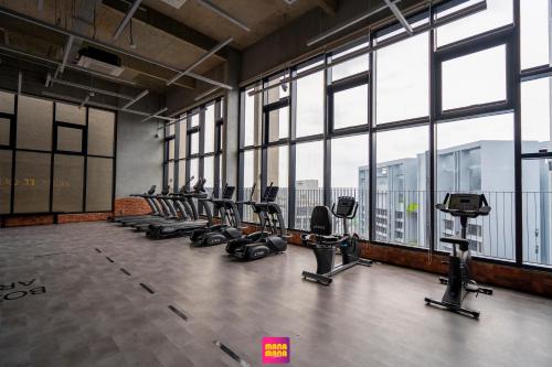 a gym with a row of chairs and windows at Millerz Square Mana-Mana Suite in Kuala Lumpur