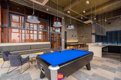 a billiard room with a pool table in it at Millerz Square Mana-Mana Suite in Kuala Lumpur
