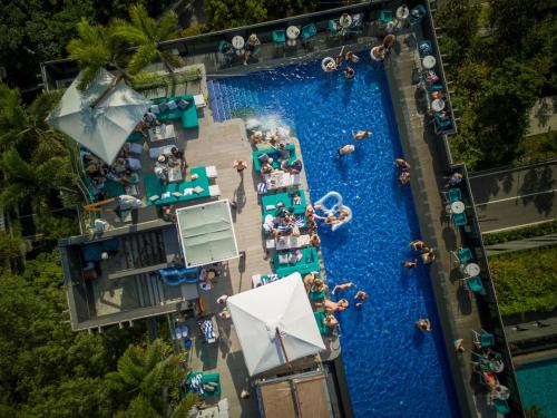 an overhead view of a water park with a pool at The Outpost Hotel Sentosa by Far East Hospitality in Singapore