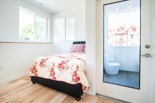 a bedroom with a bed and a window at New York loft- style 3 levels 2 Bath by Hollywood in Los Angeles