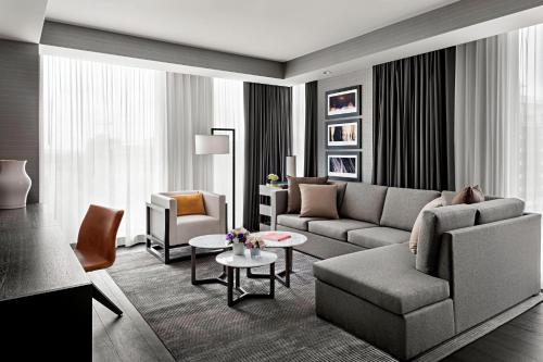 a living room with a couch and a table at Toronto Marriott Markham in Markham