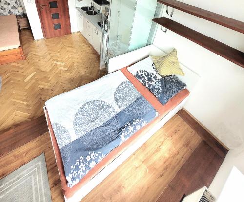 an overhead view of a bed in a room at Modern apartment few steps from centre in Prague