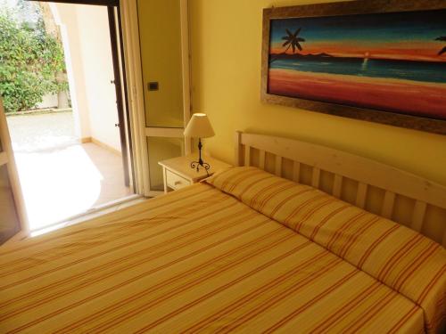 Ein Bett oder Betten in einem Zimmer der Unterkunft I tulipani di Torre Pali