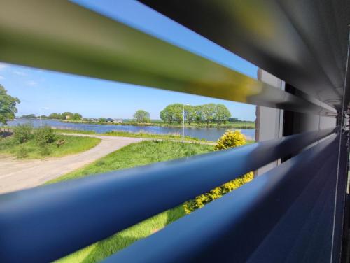 a view of a river from a train window at Guesthouse at the Amstel river with 2BR 2BA and garden in Amstelveen