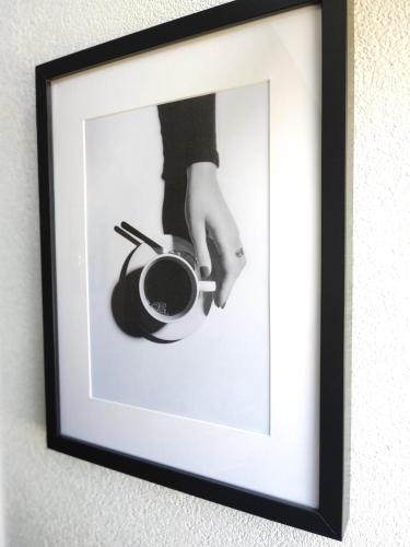 a picture of a hand holding a cup of coffee at Guesthouse at the Amstel river with 2BR 2BA and garden in Amstelveen