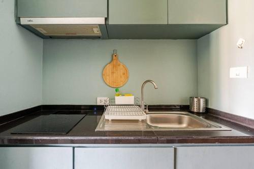 a kitchen with a sink and a counter top at Dreamcatcher Condo/ Replay Condominium in Bophut 