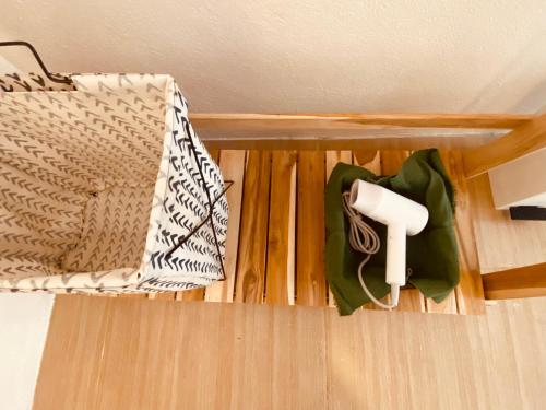 a towel holder on a shelf in a room at Pai Casita in Pai