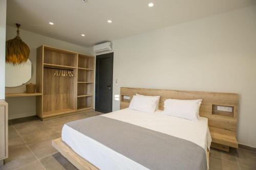 Ένα ή περισσότερα κρεβάτια σε δωμάτιο στο DeLight Luxury Rooms