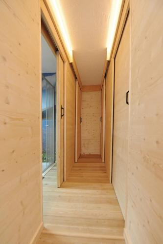 a hallway of a house with wooden walls and floors at Ferienhof Holzmeister in Sankt Jakob in Haus