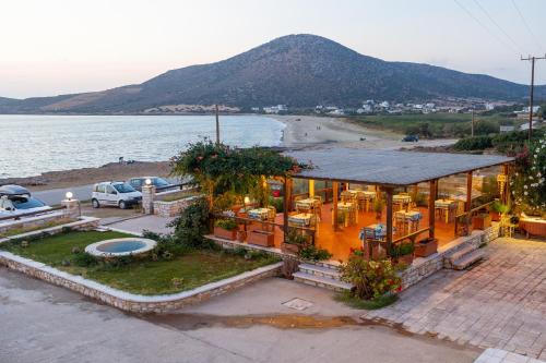 a house on the beach with a view of the ocean at Avgerinos Village in Agiassos