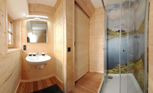 a bathroom with a sink and a shower at Ferienhof Holzmeister in Sankt Jakob in Haus