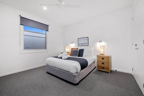 a bedroom with a large bed and a window at Marvellous Montfort in Blairgowrie