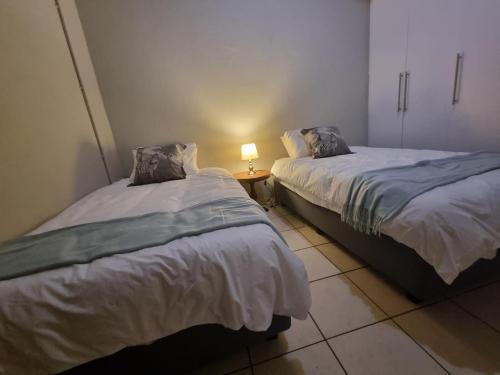 Giường trong phòng chung tại Hoep Hoep Self Catering