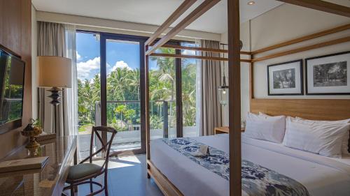 Postel nebo postele na pokoji v ubytování Plataran Ubud Hotel & Spa - CHSE Certified