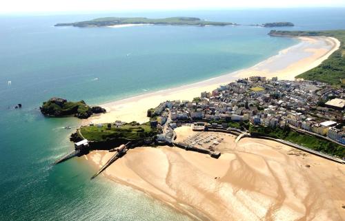 an aerial view of a beach next to the ocean at Old Quay Escape in Tenby