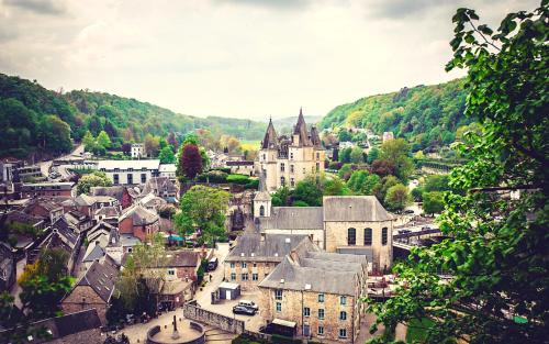 an aerial view of a town with a castle at Les Monts d'Aisne in Mormont