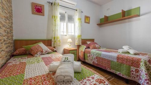 Postel nebo postele na pokoji v ubytování Casa Rural El Viso Rute by Ruralidays