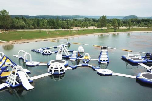 a group of water slides in a water park at Appartement cosy Lons - Montmorot in Montmorot