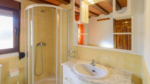 a bathroom with a sink and a shower at Cortijo la Era Castril by Ruralidays in Castril