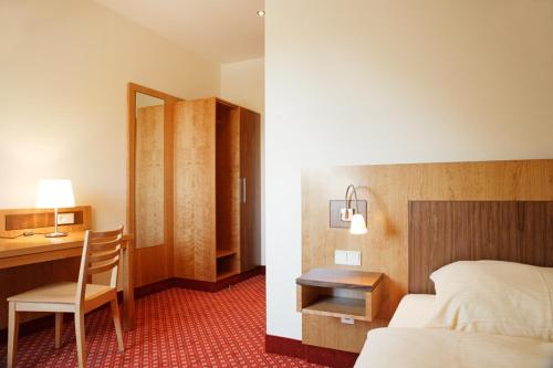 Postelja oz. postelje v sobi nastanitve Hotel Landgasthof Gschwendtner