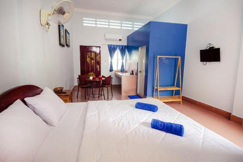 Ένα ή περισσότερα κρεβάτια σε δωμάτιο στο Lea's Guesthouse and Restaurant