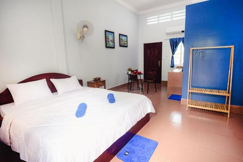Ένα ή περισσότερα κρεβάτια σε δωμάτιο στο Lea's Guesthouse and Restaurant