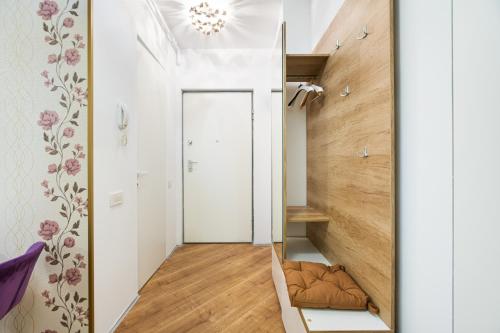 a room with a hallway with a staircase and a mirror at Luxury Pipera in Voluntari