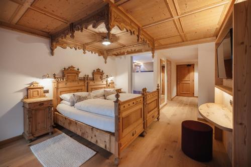 Postel nebo postele na pokoji v ubytování Albergo Posta Pederoa