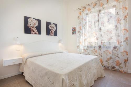 Ένα ή περισσότερα κρεβάτια σε δωμάτιο στο Villa Chiara APT 1- Appartamento in villa con piscina