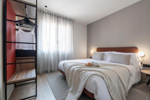 Katil atau katil-katil dalam bilik di Arrivo Apartments