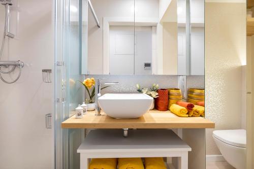 a bathroom with a sink and a shower at At-II Hub Luxury New Apartments in Barcelona