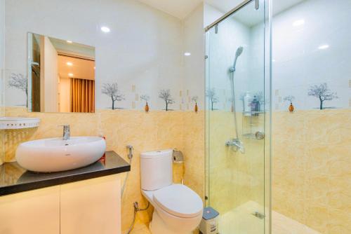 a bathroom with a toilet and a sink and a shower at Grand SaiGon Centre - RiverGate Residence, Free Gym&Pool in Ho Chi Minh City