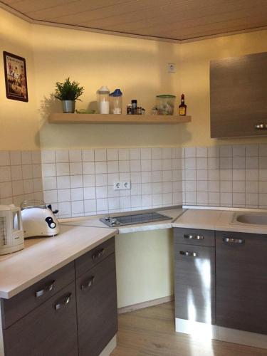 a kitchen with a sink and a counter top at Ferienwohnung-Schmidt-2 in Gelenau