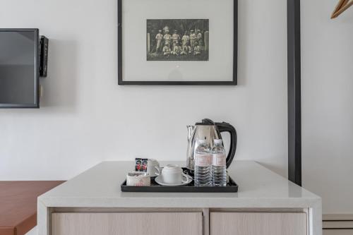 a table with a coffee maker on top of it at Crown Regency Hotel & Towers in Cebu City
